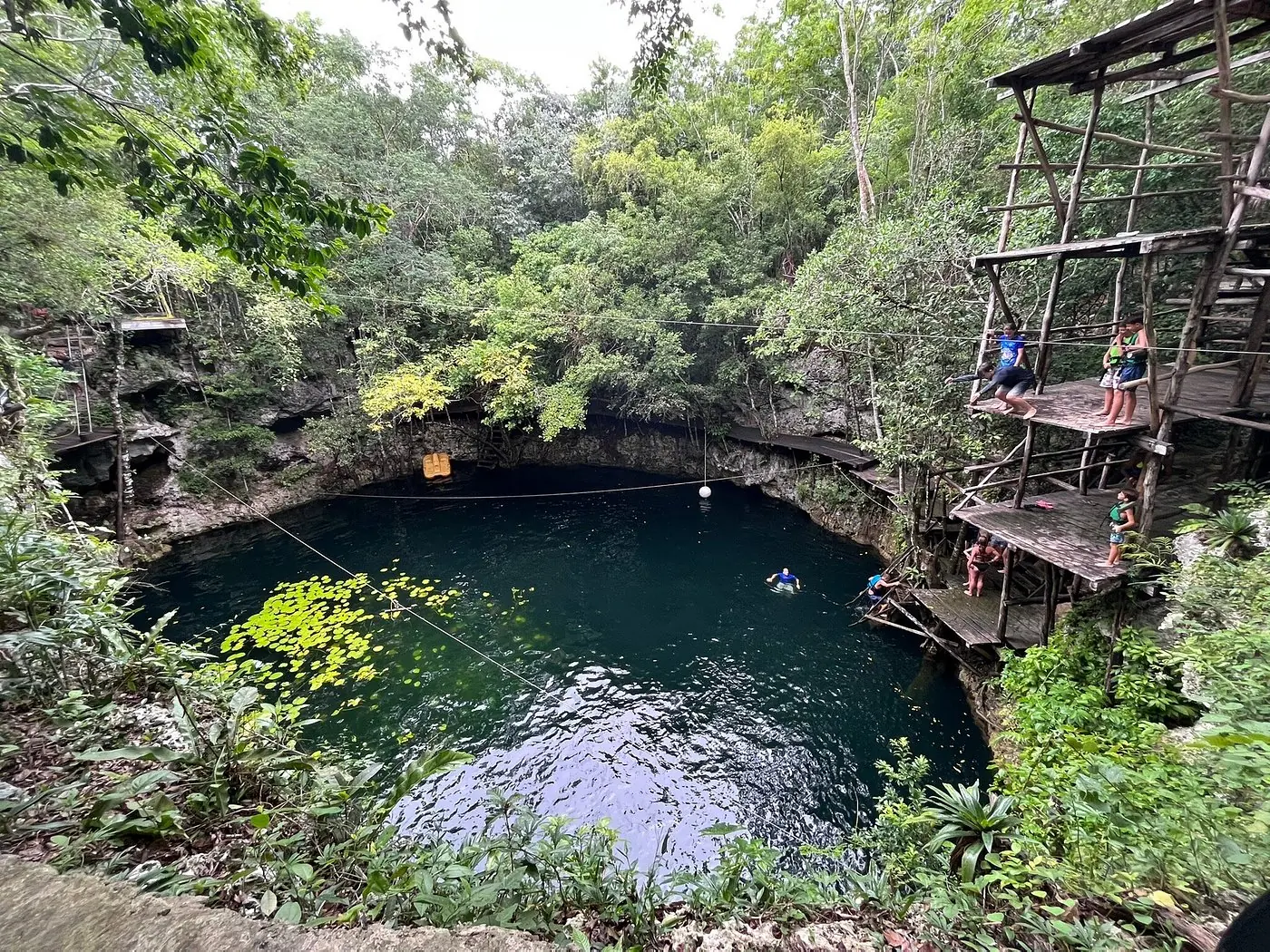 Guest jumping into a Kin-Ha cenote in Puerto Morelos