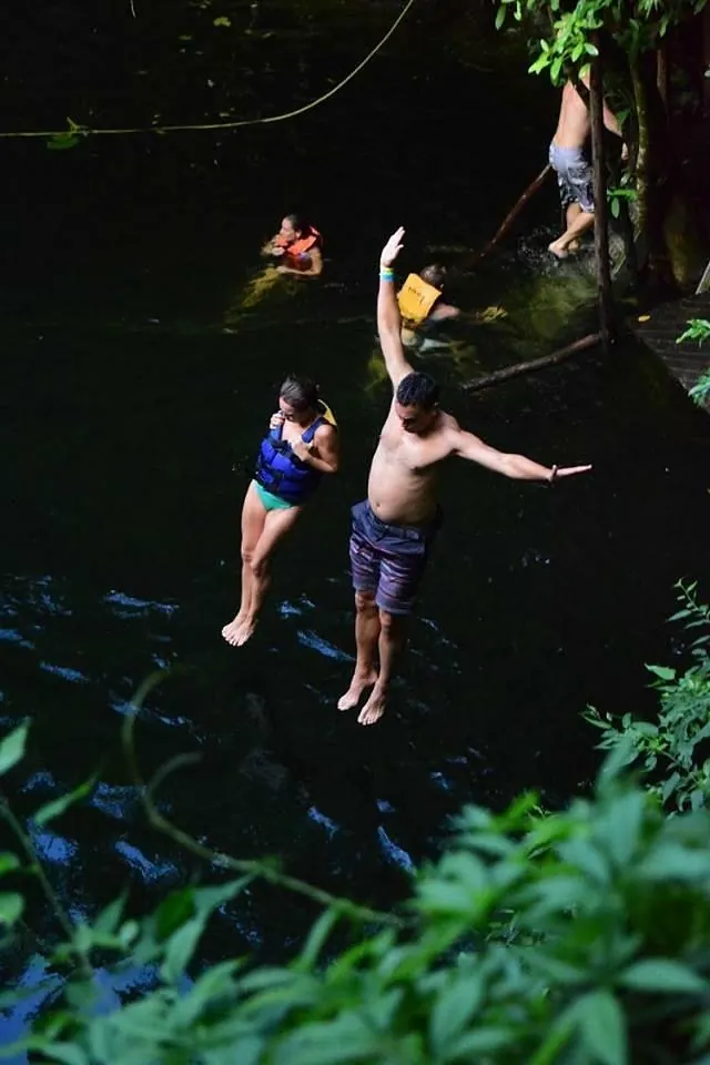 Guests jumping into a Kin-Ha cenote near Puerto Morelos