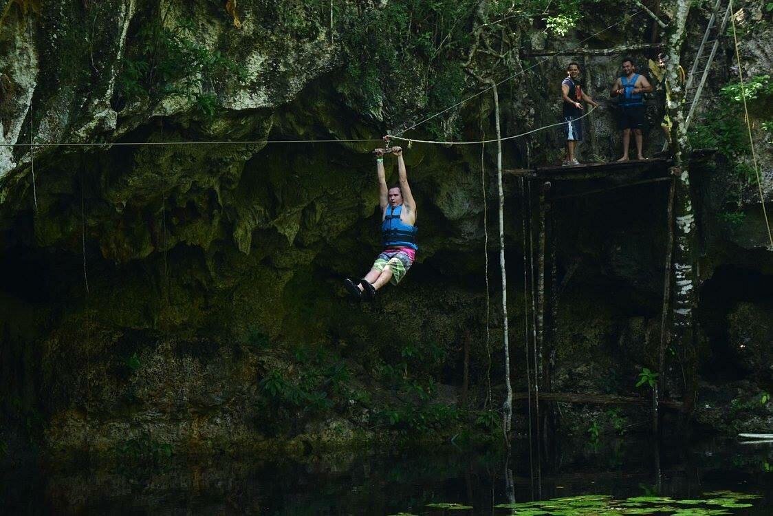 Zipline over cenote water on the Kin-Ha jungle route